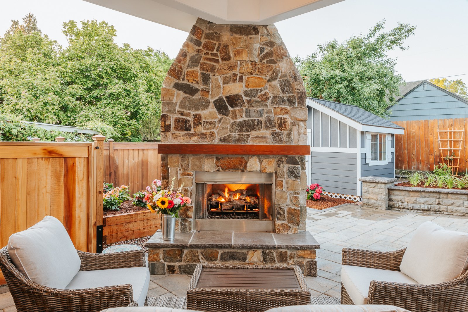Fireplace and sitting area in this Portland exterior space remodel