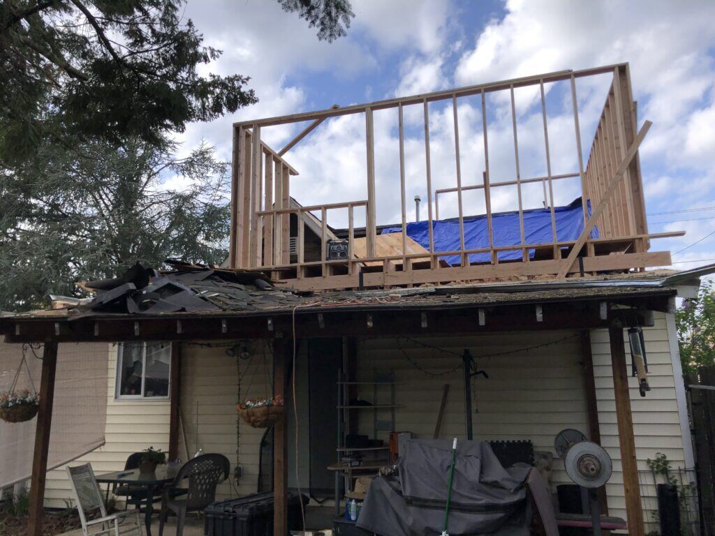 An unpermitted addition with the wall frame nearly complete
