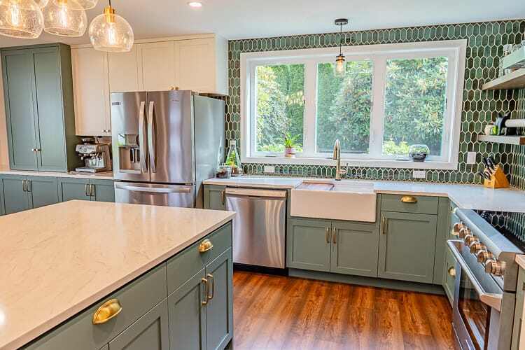 Garden Home-Whiteford Green Kitchen Addition showing stainless steel refrigerator and dishwasher with white apron front sink