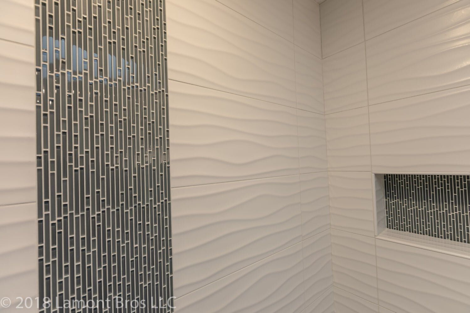 wavy tile and glass tile in shower remodel