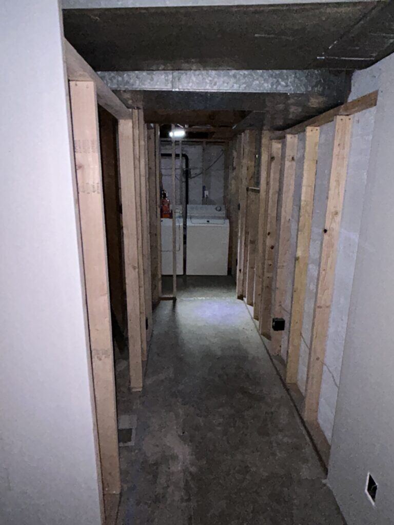basement remodel with partially completed drywall