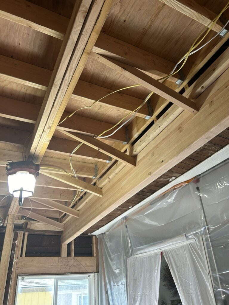 glulam beam installed to support joists in an unpermitted addition