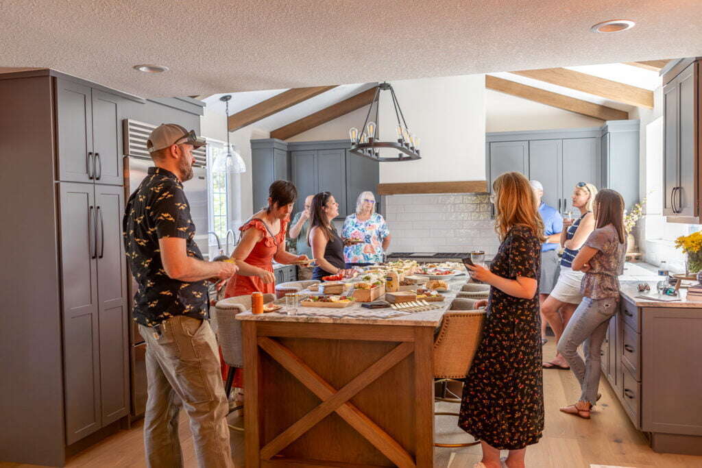 friends enjoying time together in a remodeled kitchen