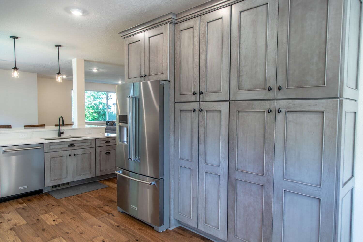 refacing vs replacing cabinets: large gray kitchen cabinets
