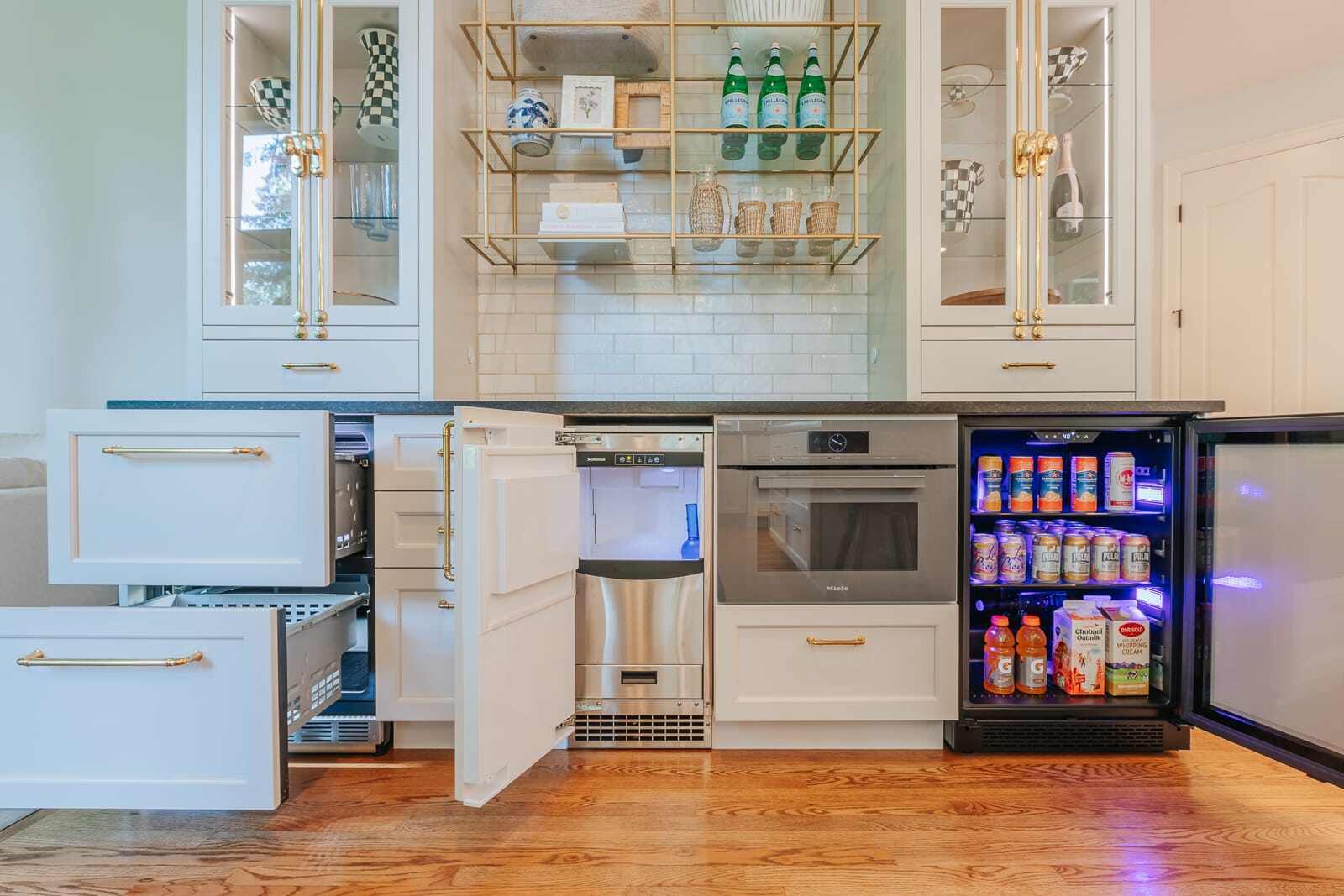 Kitchen snack bar with a mini fridge an various snack storage