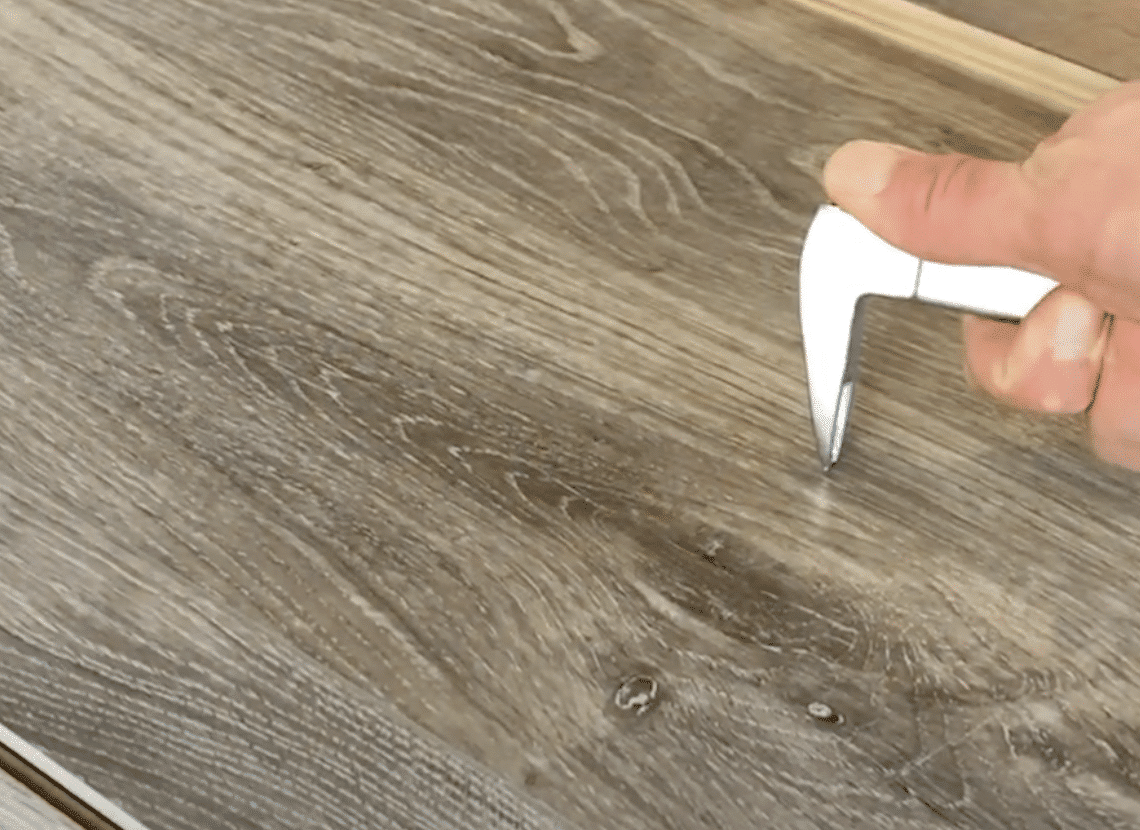 scratch resistant flooring test - Cat's Paw scratch test on luxury vinyl plank