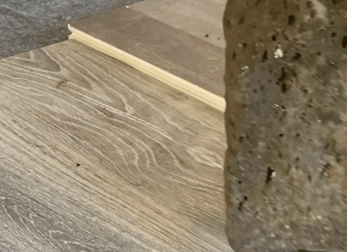 scratch resistant flooring test - rock scratch test on luxury vinyl plank