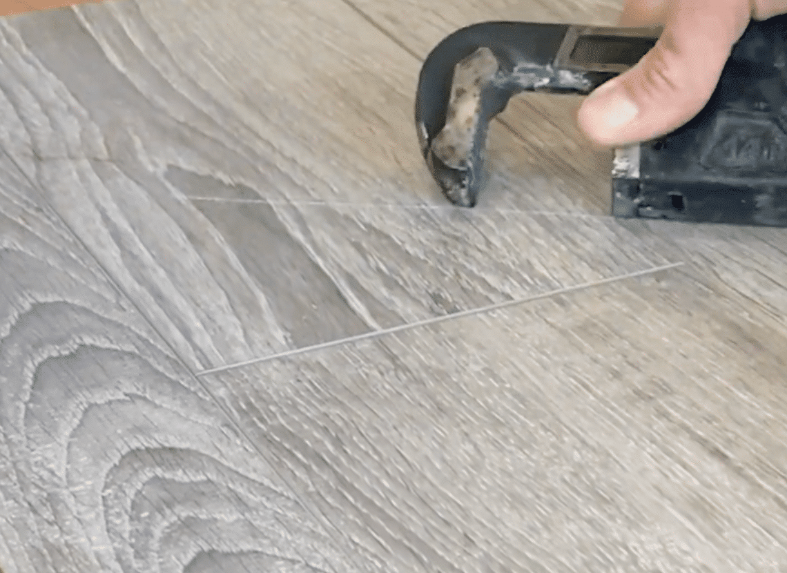 scratch resistant flooring test - pipe wrench scratch test on laminate