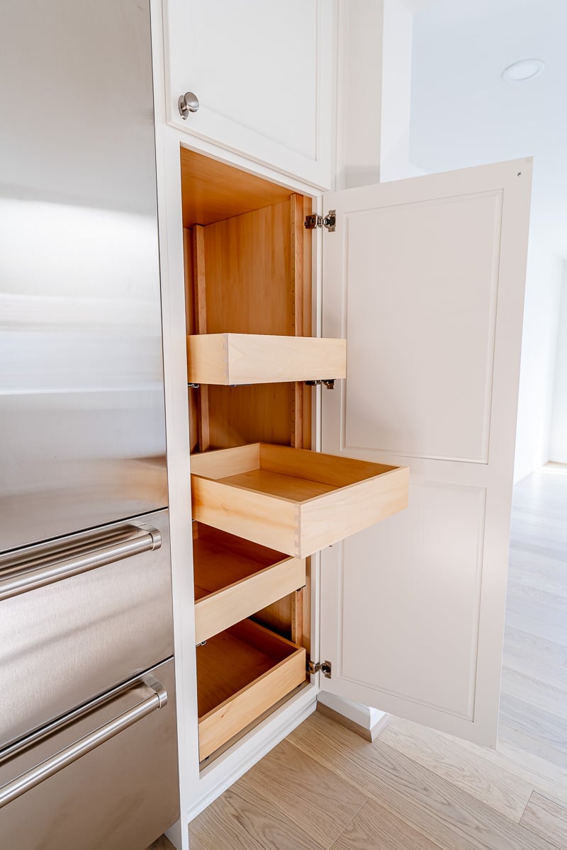 Wooden storage drawers next to SubZero fridge