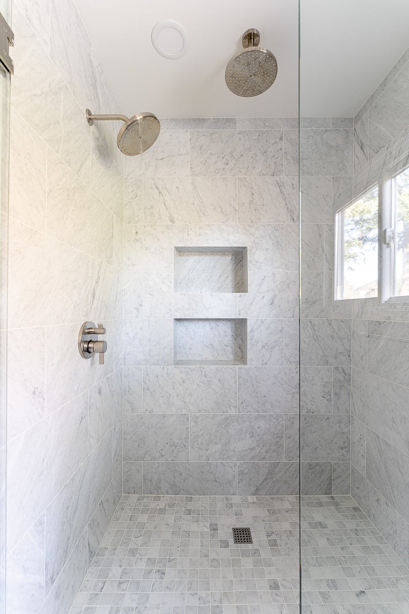 The beautiful large shower in the master bath - two shower heads and grey tile