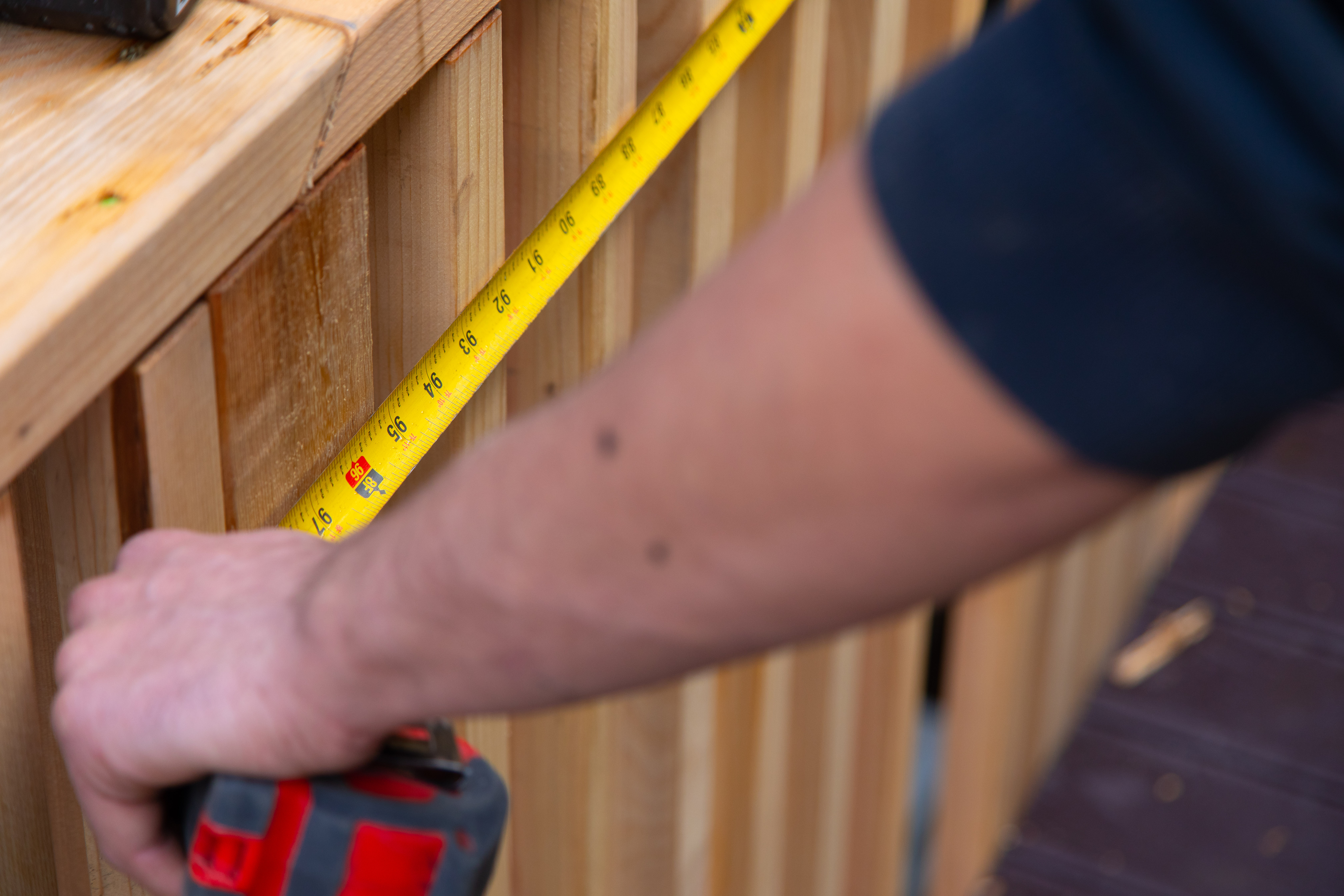 person holding measuring tape