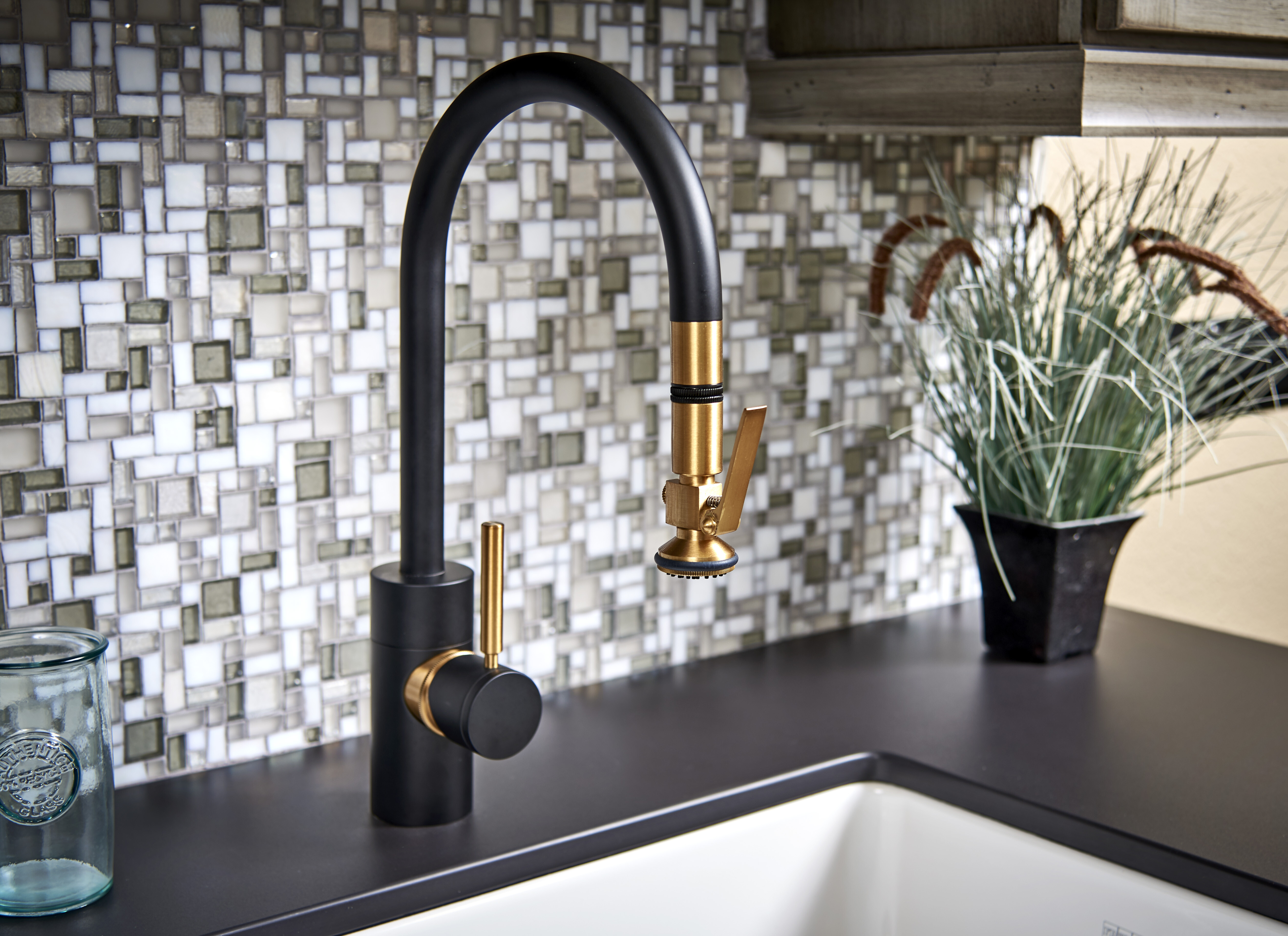 plumbing fixtures: black and gold high end faucet