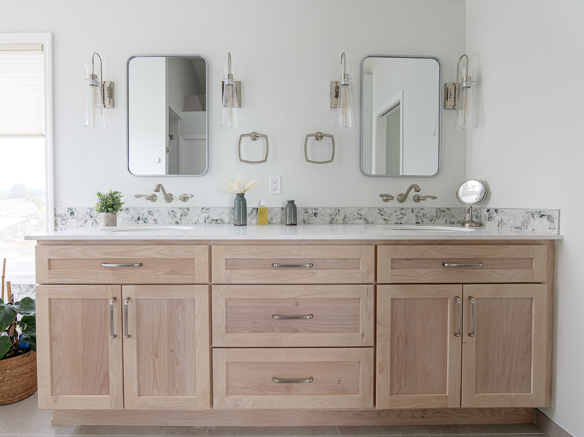 Deep soaking tub in the Leafy Tile Bathroom by Lamont Bros.